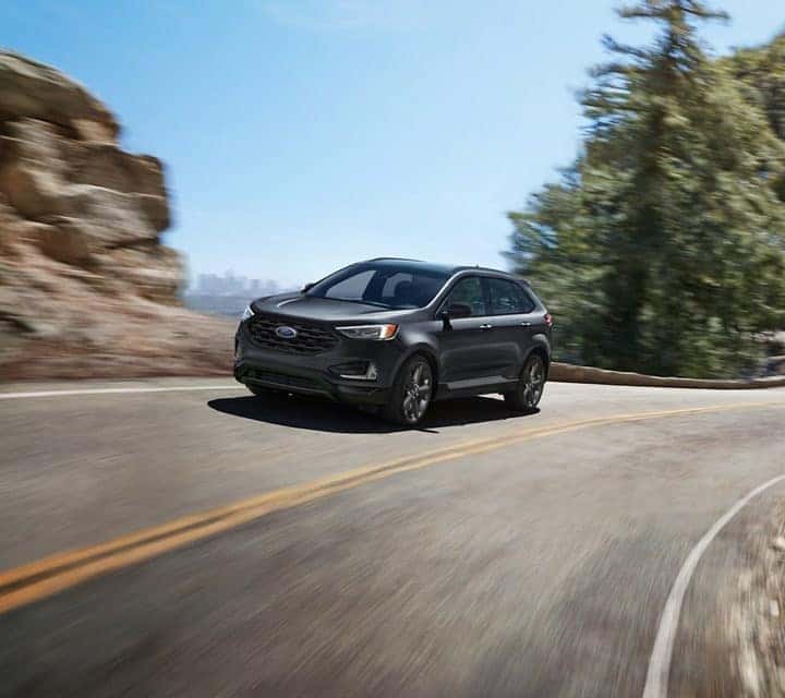 Gray Ford Edge Driving 